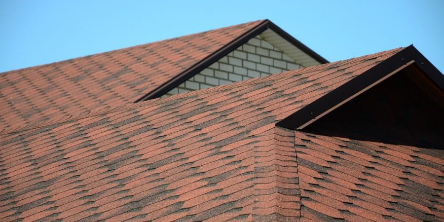 the-roof-is-covered-with-bituminous-shingles-of-brown-color-quality-roofing.jpg
